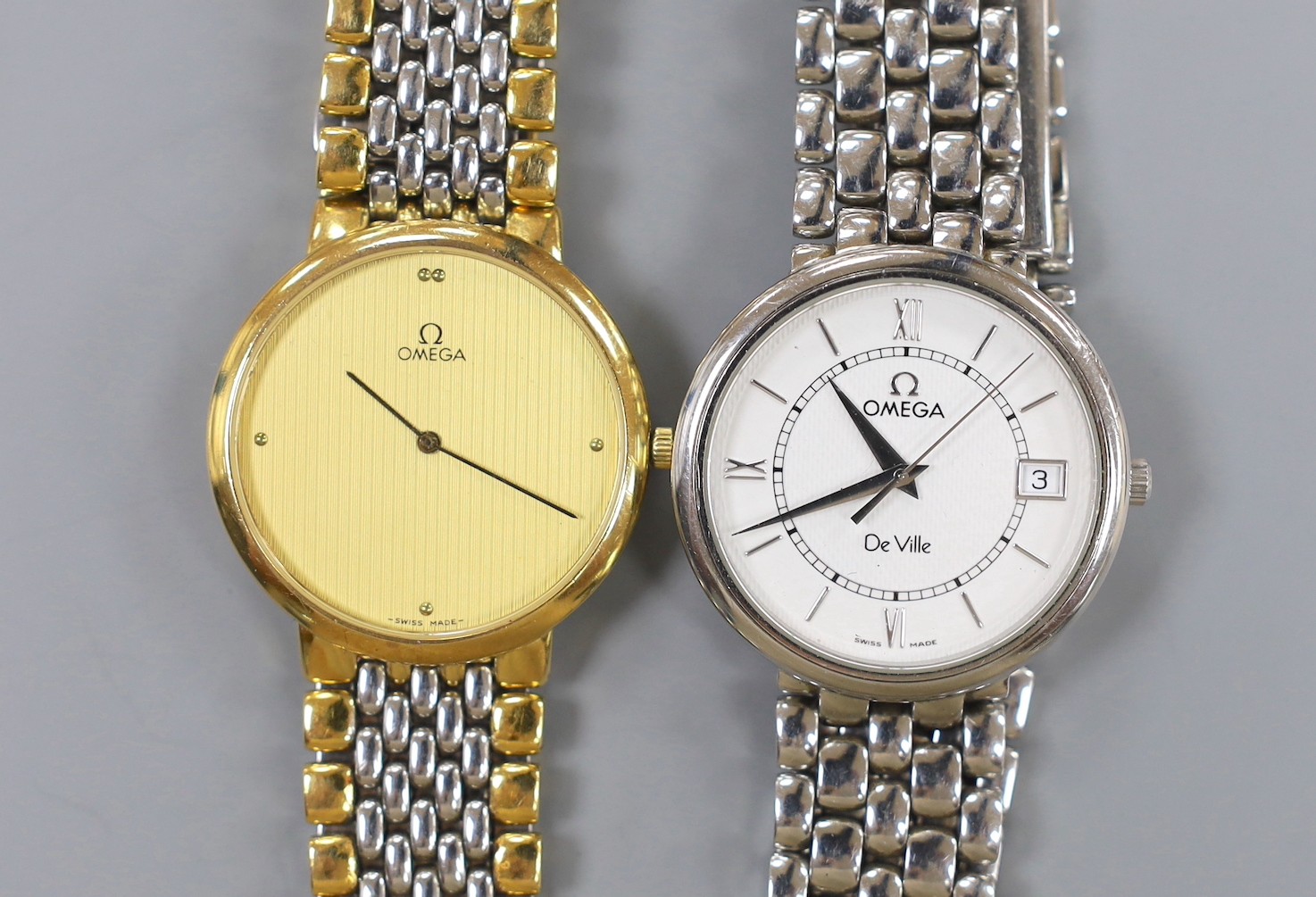 A gentleman's stainless steel Omega De Ville quartz wrist watch and a similar two tone Omega quartz wrist watch, no box or papers.